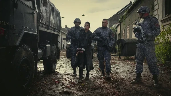 Soldiers escort a prisoner in "Tribes of Europa".